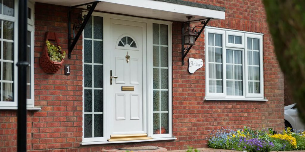 White front door with glass side panels